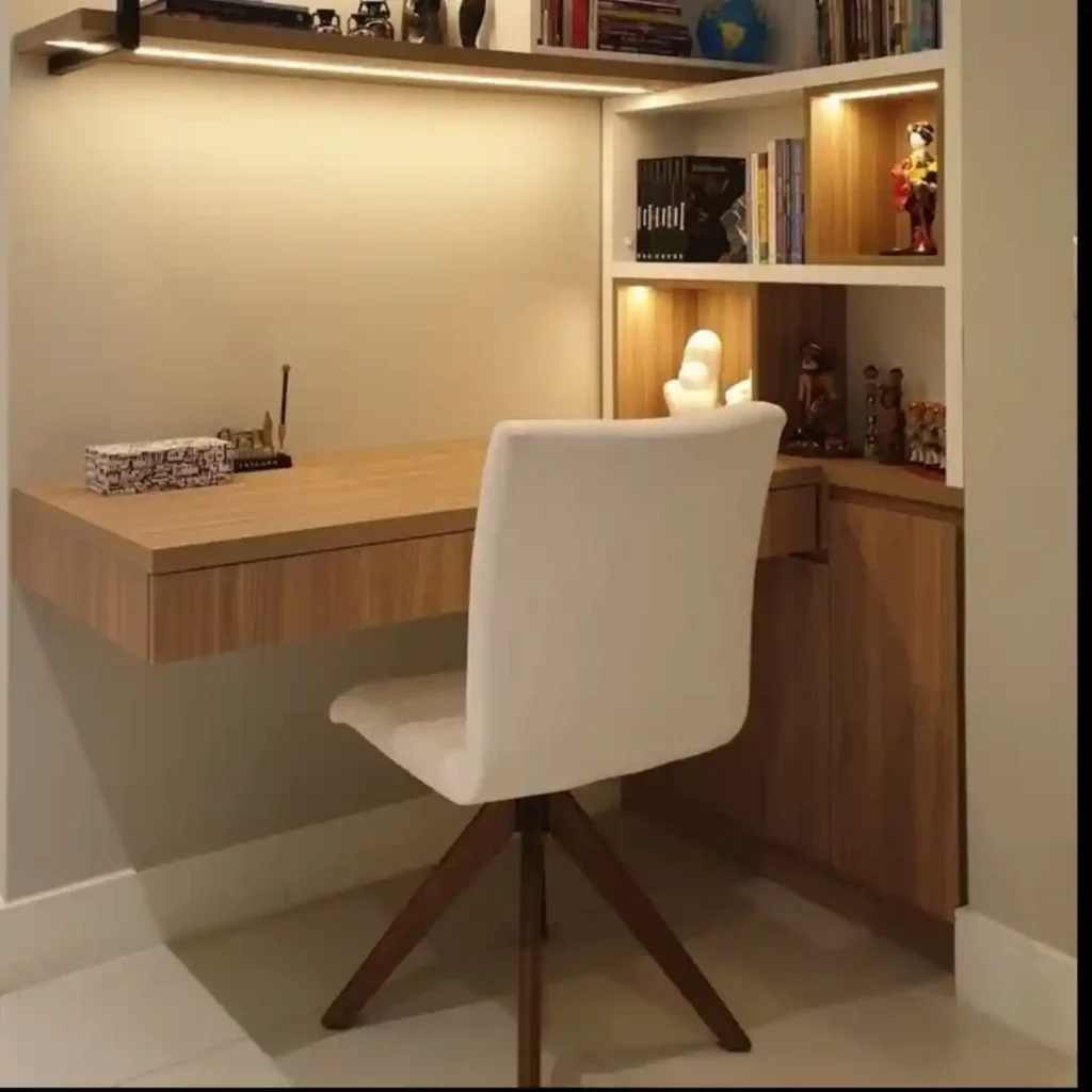 Modern floating desk with wooden top, built-in shelves, LED lighting, white chair, and corner storage — sleek home office design