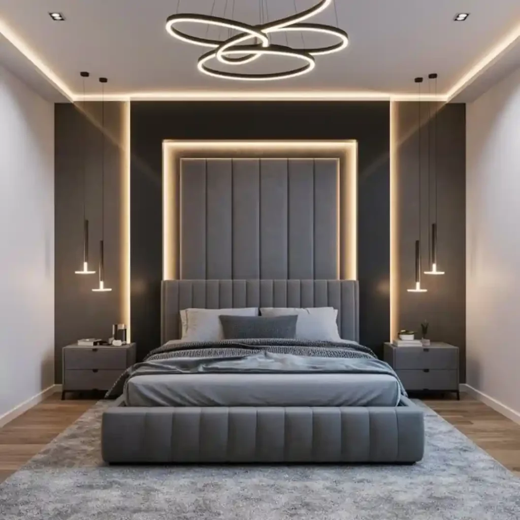 Modern bedroom with gray upholstered bed, LED lighting, ring chandelier, and black accent wall — sleek luxury design