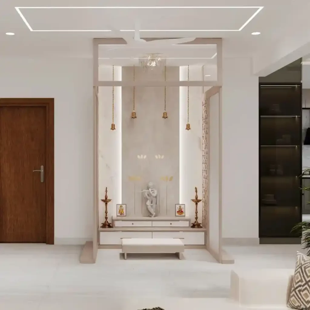 Minimalist modern pooja room with Krishna idol, hanging bells, LED lighting, and marble finish — elegant Indian prayer space design