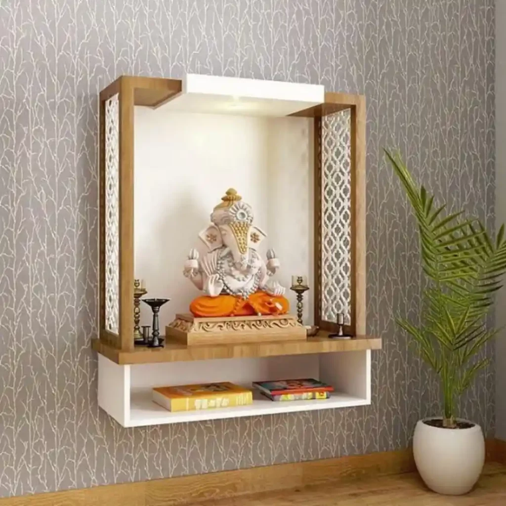 Wall-mounted temple with Ganesha idol and decorative lattice
