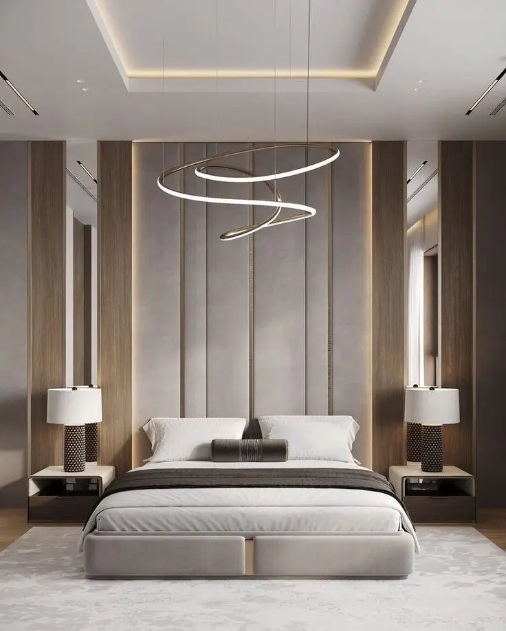 Modern bedroom with a sleek bed, wooden paneling, and spiral pendant light, ideal for homes in Delhi, Gurgaon, and Noida